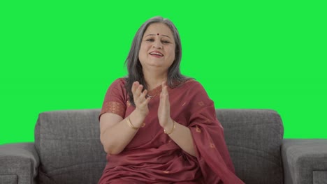 Happy-Indian-old-woman-clapping-and-appreciating-Green-screen