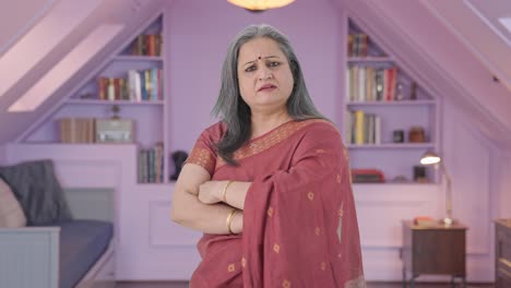 Portrait-of-Confident-Indian-old-woman-standing-crossed-hands