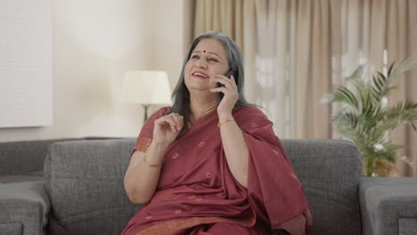 Happy-Indian-old-woman-talking-on-call