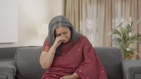 Sick-Indian-old-woman-suffering-from-cold-and-cough