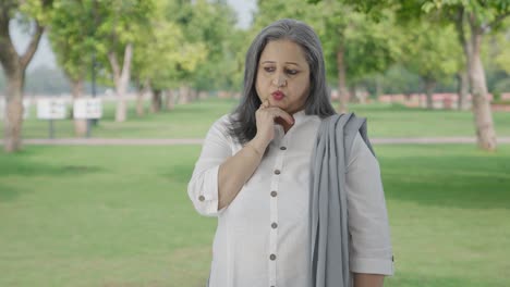 Confused-Indian-mother-thinking-something-in-park