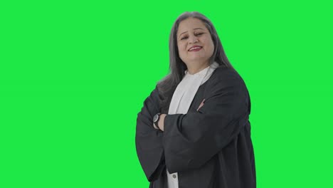 Portrait-of-Happy-Indian-female-lawyer-standing-crossed-hands-Green-screen