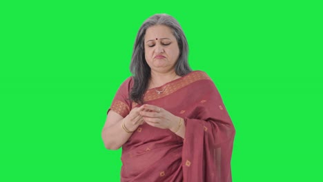 Sick-Indian-old-woman-suffering-from-hairfall-Green-screen