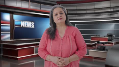 Indian-senior-female-journalist-looking