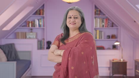 Portrait-of-Happy-Indian-old-woman-standing-crossed-hands