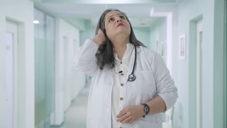 Stressed-and-tensed-Indian-senior-female-doctor