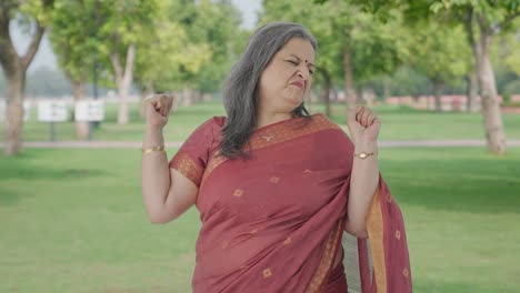 Lazy-Indian-old-woman-yawning-in-park