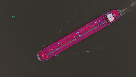 The-Kalahari-Cargo-Vessel-is-Navigating-the-River-in-Barendrecht,-South-Holland,-Netherlands---Aerial-Topdown-Shot