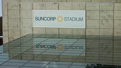 The-sign-of-Suncorp-Stadium-on-the-building-exterior-and-glass-reflection-of-multi-purpose-stadium-in-Brisbane-city