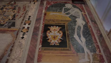 A-tilt-up-of-a-marble-skeleton-figure-at-the-Co-Cathedral-of-Saint-John-in-Valletta,-Malta