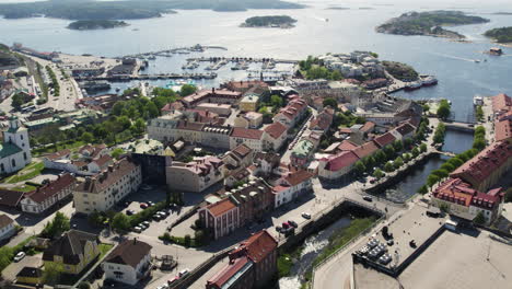 Strömstad,-sweden-on-a-sunny-day-with-the-harbor-and-islands-in-the-background,-aerial-view