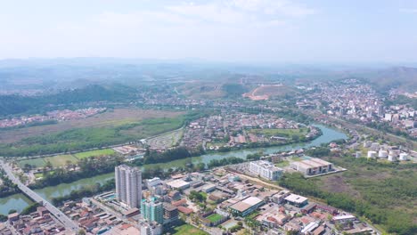 Aerieal-view-of-the-famous-river-symbol-of-the-city-of-Volta-Redonda,-Rio-de-Janeiro,-Brazil,-showing-the-Paraíba-do-Sul-River