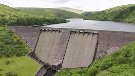 Drone-orbital-view-of-Meldon-Reservoir-showcasing-natural-beauty-in-Dartmoor-National-Park,-UK