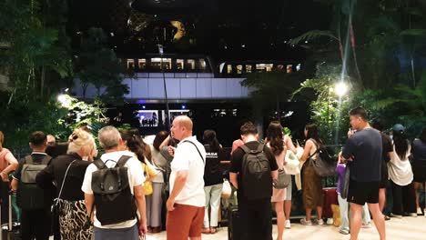 Crowds-of-people-watching-passenger-trains-in-Jewell-Shopping-Centre-at-Singapore-Changi-Airport