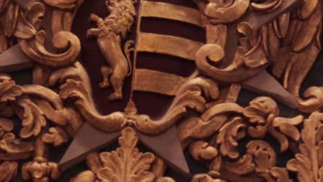 An-amazing,-detailed-shot-of-a-shield-with-cherubs-at-the-Co-Cathedral-of-Saint-John-in-Valletta,-Malta