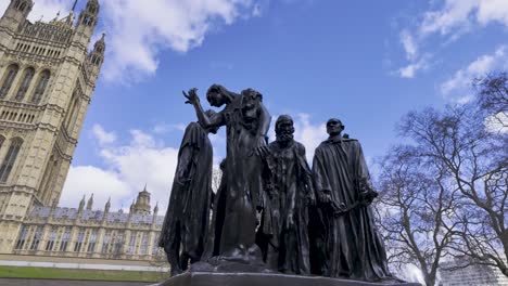 The-Burghers-of-Calais-Statue-at-Abington-Street-in-front-of-the-Palace-of-Westminster,-House-of-Parliament-in-London,-England,-UK---March-24,-2024