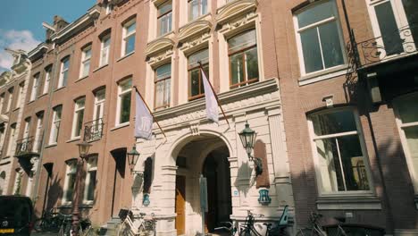 Hollandsche-Manege-exterior-in-Amsterdam-city-street-with-sunlight-illuminating-its-historic-facade