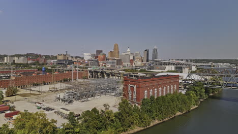 Cincinnati-Ohio-Aerial-v56-flyover-river-capturing-Queensgate-industrial-neighborhood,-freeway-traffic,-riverside-Paycor-stadium-and-downtown-cityscape---Shot-with-Mavic-3-Pro-Cine---September-2023