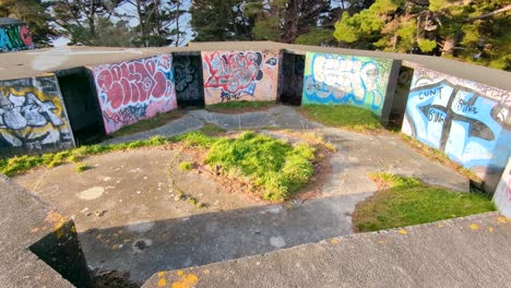 Visiting-WW2-bunkers-with-graffiti-at-The-Massey-Memorial,-Point-Halswell-in-Wellington,-New-Zealand-Aotearoa