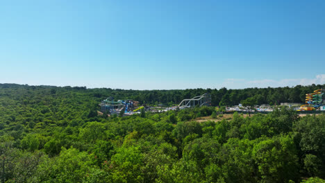 Drone-rising-around-the-Aquapark-Istralandia-water-park,-in-sunny-Istria,-Croatia