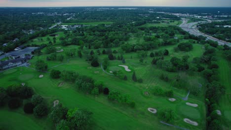 Aerial-view-of-the-golf-terrain-south-of-Chicago,-highlighting-the-expansive-green-landscape-and-intricate-design-of-the-course