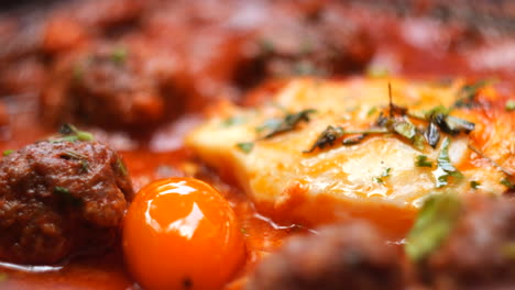 Close-Up-of-Traditional-Moroccan-Tagine-Dish-with-Meatballs-and-Eggs