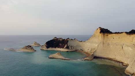 Orbital-View-of-Cape-of-Drastis-Corfu-Coast-Cliff,-Greece