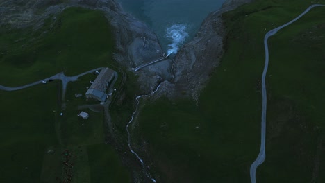 Peaceful-aerial-landscape-of-Mont-Cenis-Lake-sunrise-with-snow-capped-alpine-mountains