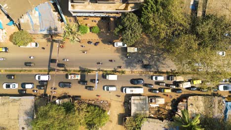 Bird's-eye-view-top-down-rising-from-bustling-street-in-Mumbai,-India