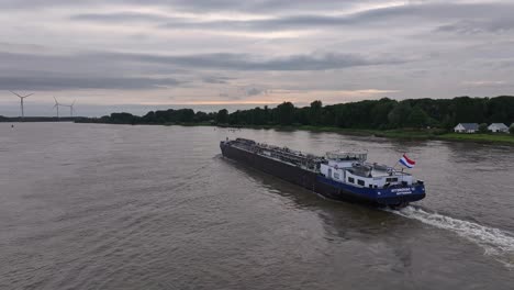 HYDROVAC-12-Navigating-River-In-Barendrecht,-Netherlands---Drone-Shot