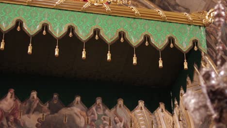 A-tilt-down-of-a-pallium,-part-of-a-baldachin,-in-the-Co-Cathedral-of-Saint-John-in-Malta