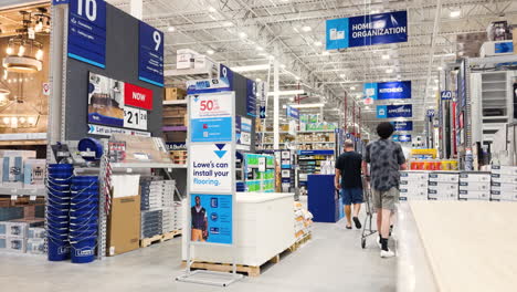 Wide-shot-in-Lowe's-Home-Improvement-Hardware-store,-with-people-walking-away-from-camera