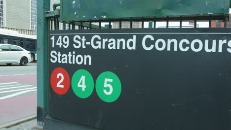 Close-Up-Pan-Right-of-a-MTA-subway-entrance-sign-at-149-Street-and-Grand-Concourse-in-the-Bronx