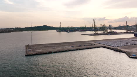 Rows-of-automobiles,-stand-ready-for-their-journey-across-the-seas,-aerial