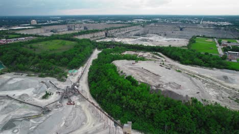 Aerial-view-of-Thornton-Quarry,-one-of-the-largest-aggregate-quarries-worldwide,-located-south-of-Chicago-in-Thornton,-Illinois,-showcasing-its-extensive-commercial-stone-mining-operations