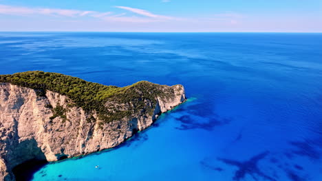 Aerial-pan-view-of-Zakynthos-Sala-at-Navagio-Pludmale-in-Greece-during-afternoon