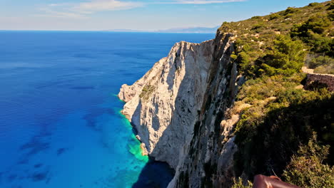 Profile-view-of-seascape-at-Navagio-Pludmale-during-daytime-near-Zakynthros-Sala-in-Greece