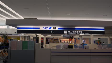 Walking-from-the-far-right-to-the-opposite-side,-capturing-the-ANA-check-in-counter-at-Kobe-Airport