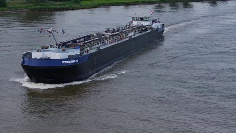 HYDROVAC-12-Ship-Cruising-River-In-Barendrecht,-Netherlands---Drone-Shot