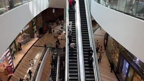 Jewel-Singapore-Changi-Airport-shopping-complex-panning-down-escalators-wide-shot