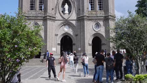 Tilt-down-imposing-facade-of-Catholic-basilica-in-Jardin,-Colombia