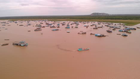 Aerial-footage-of-a-floating-village-in-Tonle-Sap-Lake-near-Siem-Reap-in-Cambodia