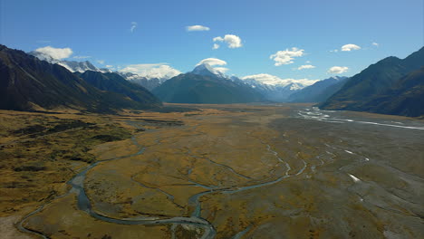 The-Tasman-River-flowing-from-Mont-Cook-or-Aoraki-snow-capped-mountain---aerial-view