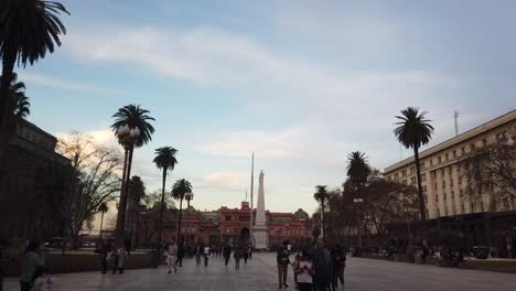 People-Walk-at-Plaza-de-Mayo,-panoramic-square-of-Buenos-Aires-City,-Argentina