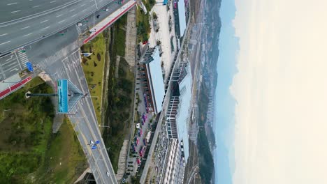 Rapid-transit-railway-station-next-to-multi-lane-highway-in-Zhangjiajie,-China