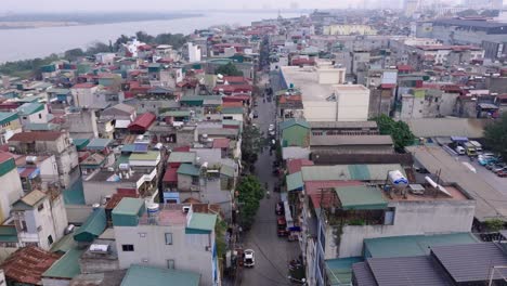 This-footage-captures-a-densely-packed-urban-neighborhood-in-Hanoi,-showcasing-a-variety-of-residential-buildings-and-narrow-streets