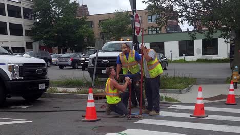 Men-in-hard-hats-working-to-repair-sewer-in-Portland,-Me