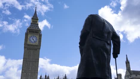 The-Statue-of-Sir-Winston-Churchill-facing-the-Big-Ben-at-Palace-of-Westminster,-House-of-Parliament-in-London,-England,-UK---March-24,-2024