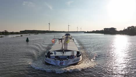 AMOUREUS-Ship-Sailing-In-The-River-In-Barendrecht,-Netherlands---Aerial-Drone-Shot