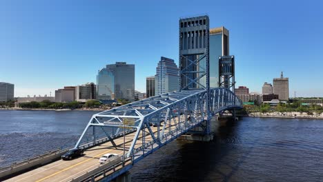 Cars-on-bridge-over-St-Johns-River-and-modern-skyline-in-Background